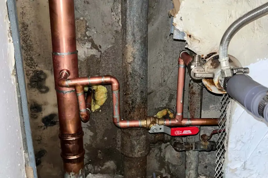Water lines, risers and valves in a mechanical room